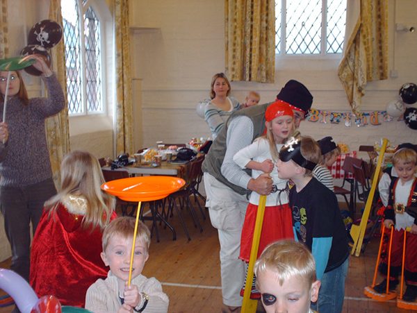 Kids spinning plates on sticks