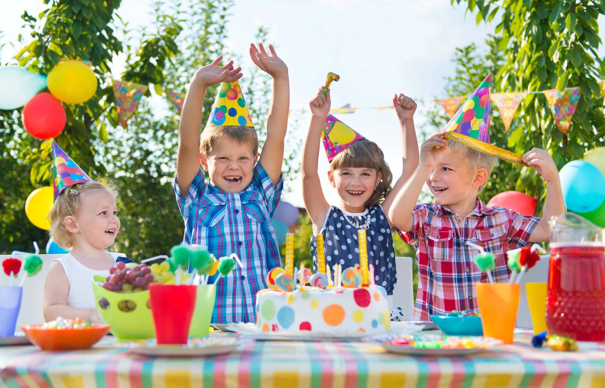 Group of adorable kids having fun at birthday party